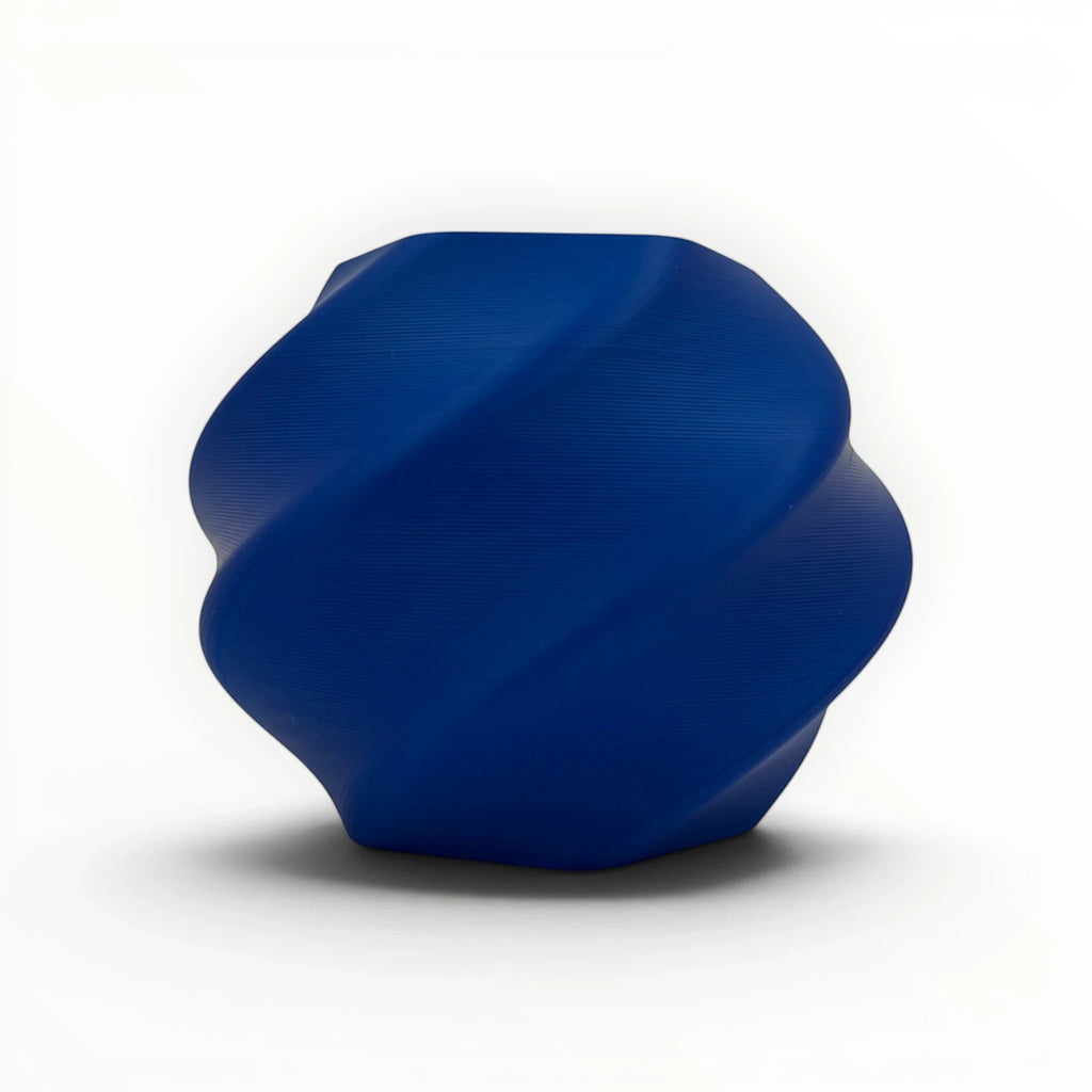 Templast dark blue PLA Pro filament, 1.75mm diameter, with a twisted, modern design. Ideal for 3D printing.